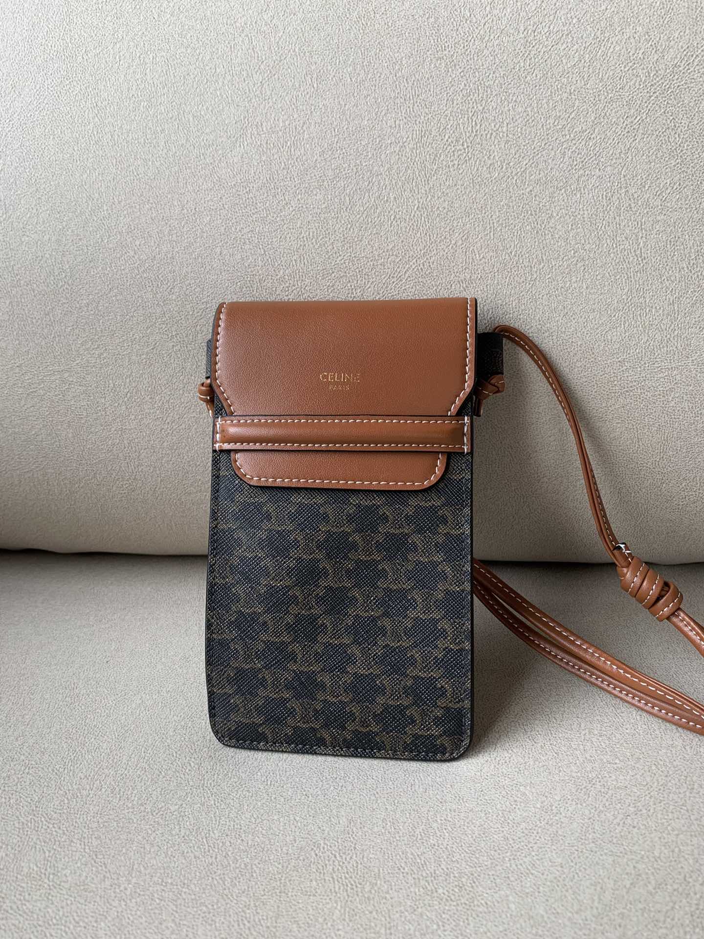 Celine Phone Pouch With Flap In Triomphe Canvas And Lambskin Tan For Women 7in/18cm 10G332CQD.04LU